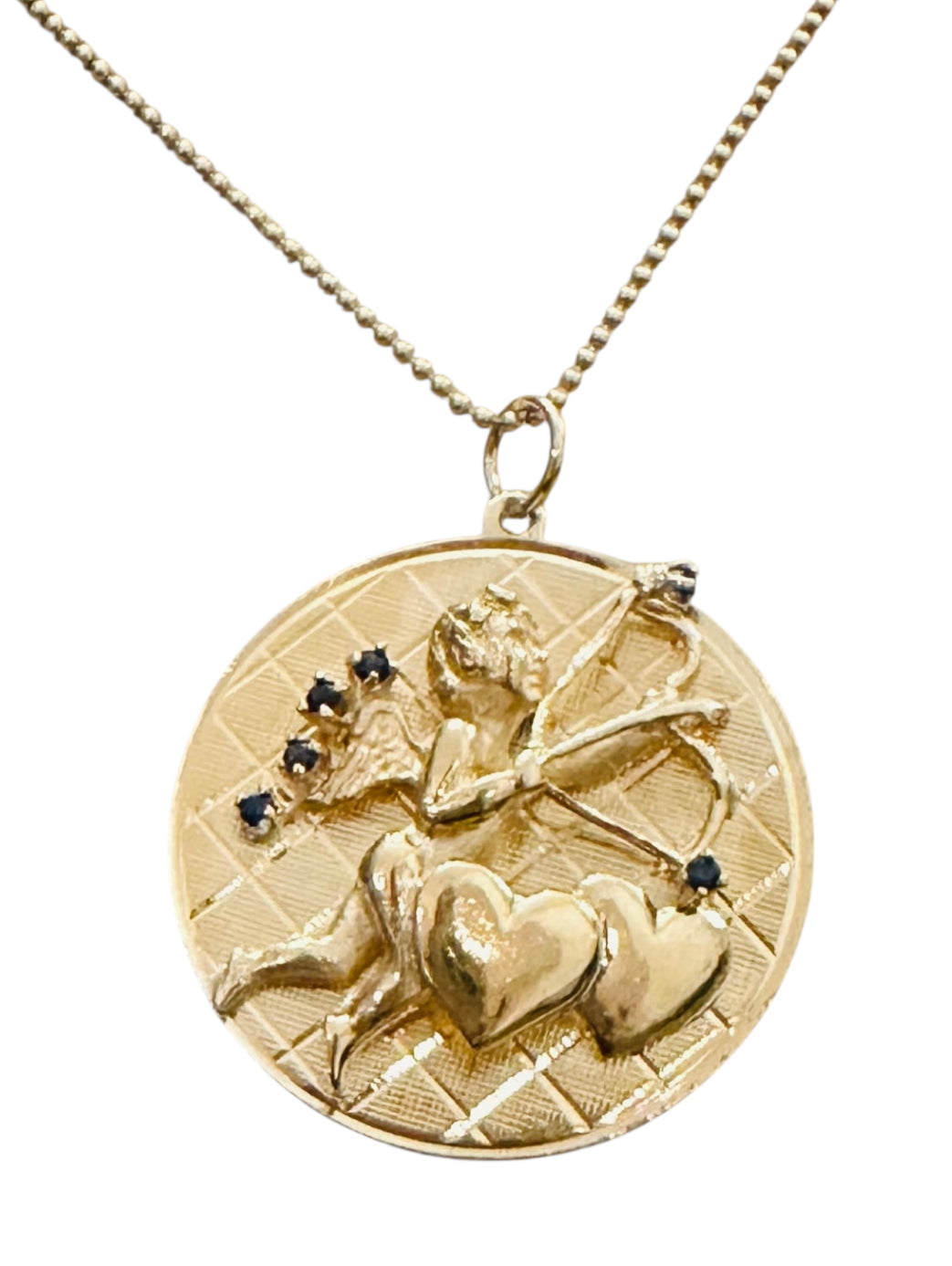Vintage 14KT Gold Cupid Charm with Blue Sapphires.